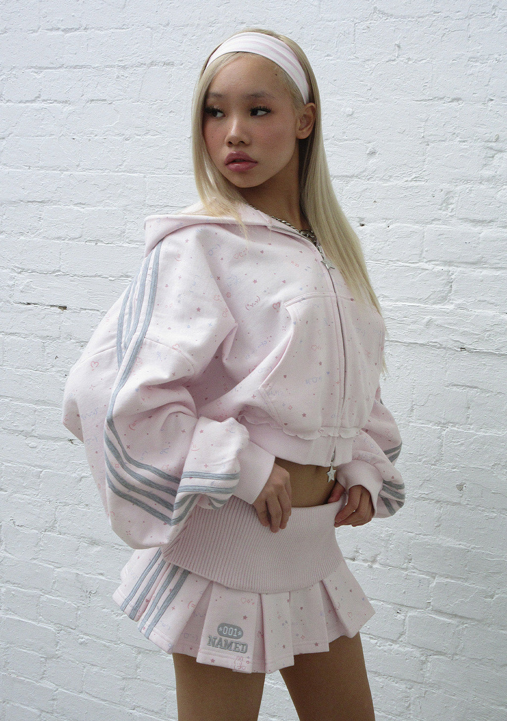 MALFUNCTION SPORTY PLEATED MINI SKIRT BABY PINK