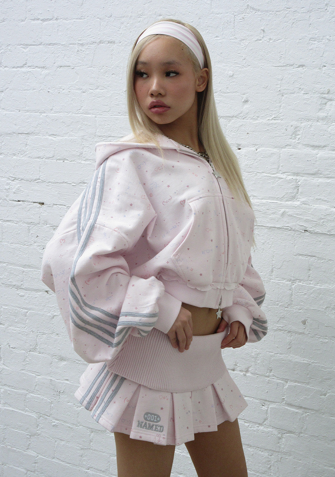 MALFUNCTION SPORTY PLEATED MINI SKIRT BABY PINK